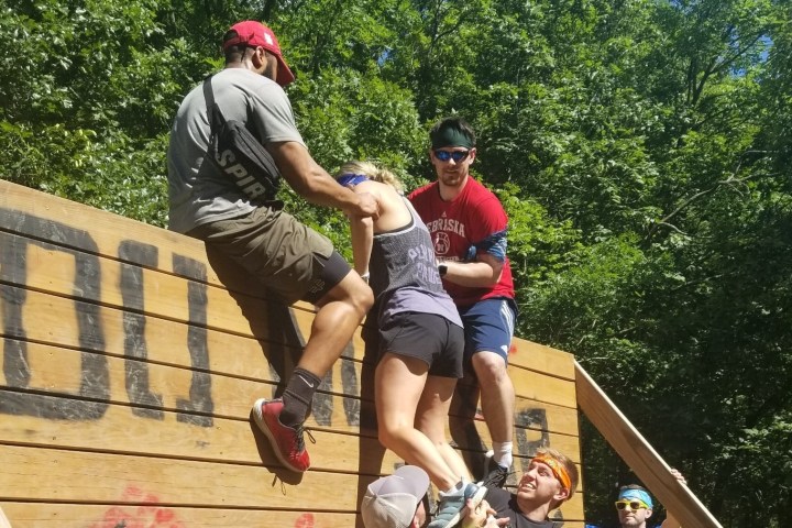 A team Building group in the woods participating in the Great wall Challenge.